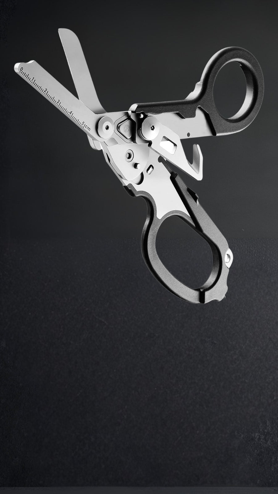 Foldable 6-in-1 trauma shears in 420HC steel on black background