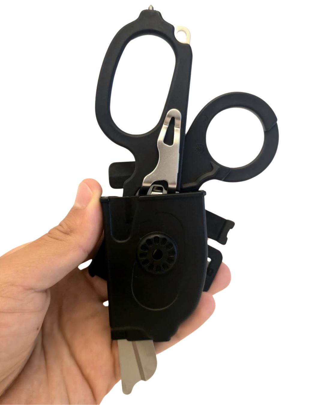 6-in-1 trauma shears in open-carry holster for instant one-hand draw; blades protected.